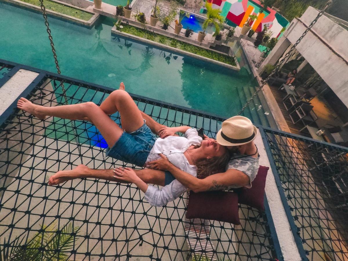 Hotel Makaaba Eco-Boutique Bacalar Exterior photo A couple on a hammock